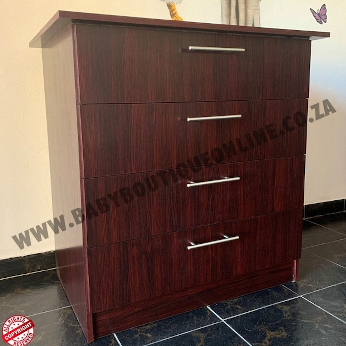 Wooden dresser with four drawers on a tiled floor.