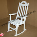White rocking chair on a brown background with visible branding.