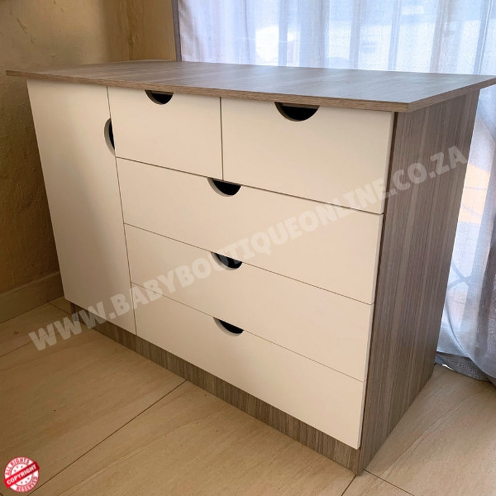 Wooden dresser with four drawers on a wooden floor.Large Compactum 5 Drawer White & Cascade B0374