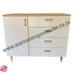 White dresser with wooden accents and drawers on a white background