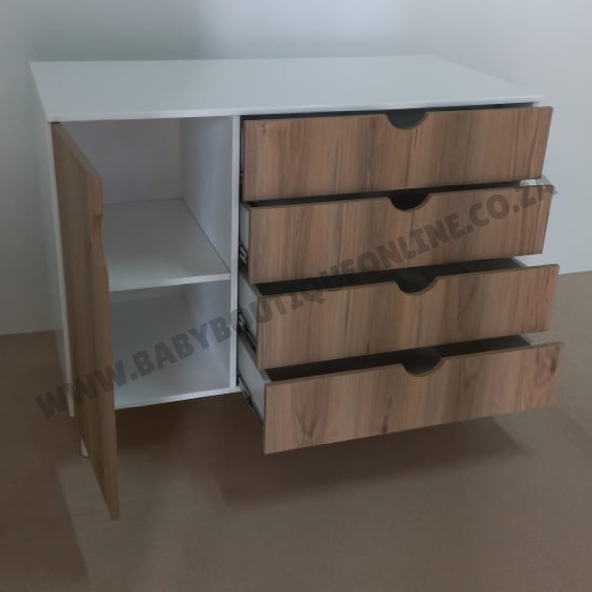 Wooden dresser with three drawers and a white top on a plain background