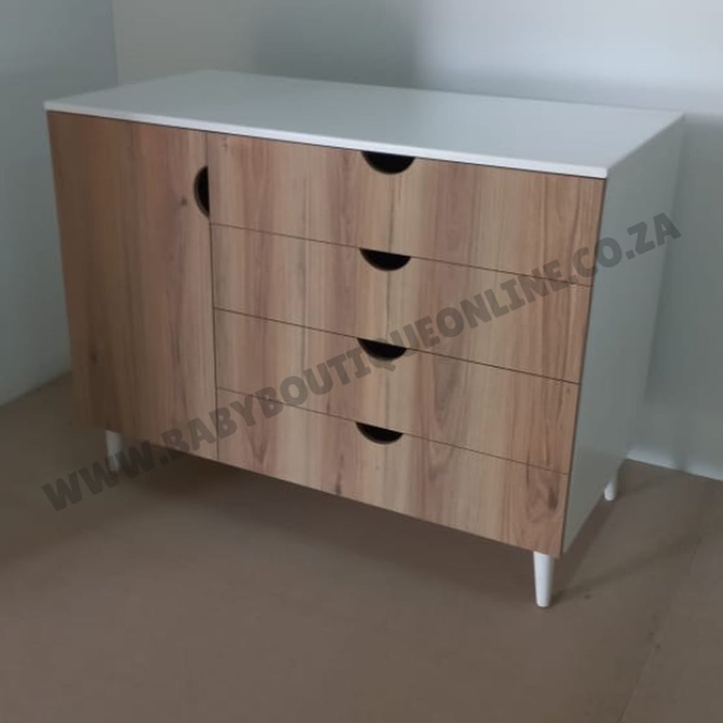 Wooden dresser with white top in a minimalistic room