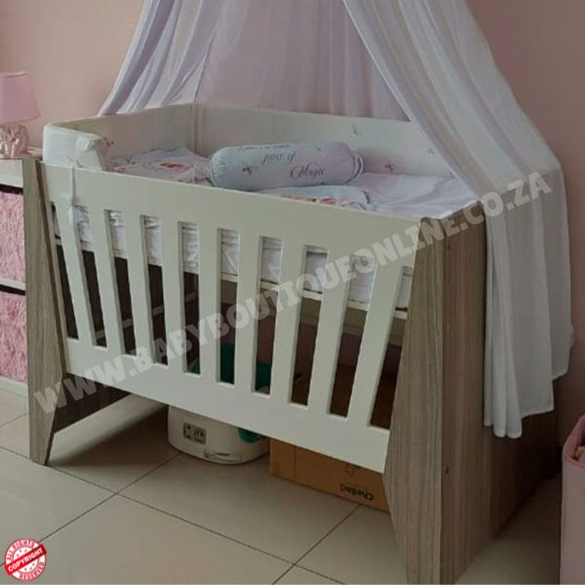 Emma Large Wooden Cot-White_Cascade Wooden crib with white bedding in a room setting