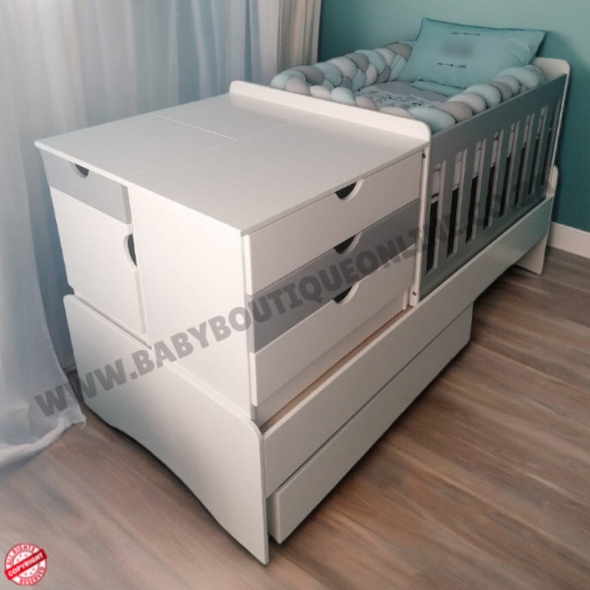 BabyBedroominabox-5in1 White crib with drawers in a room setting, featuring a visible brand watermark.