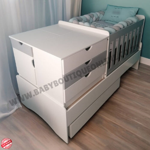 BabyBedroominabox-5in1 White crib with drawers in a room setting, featuring a visible brand watermark.